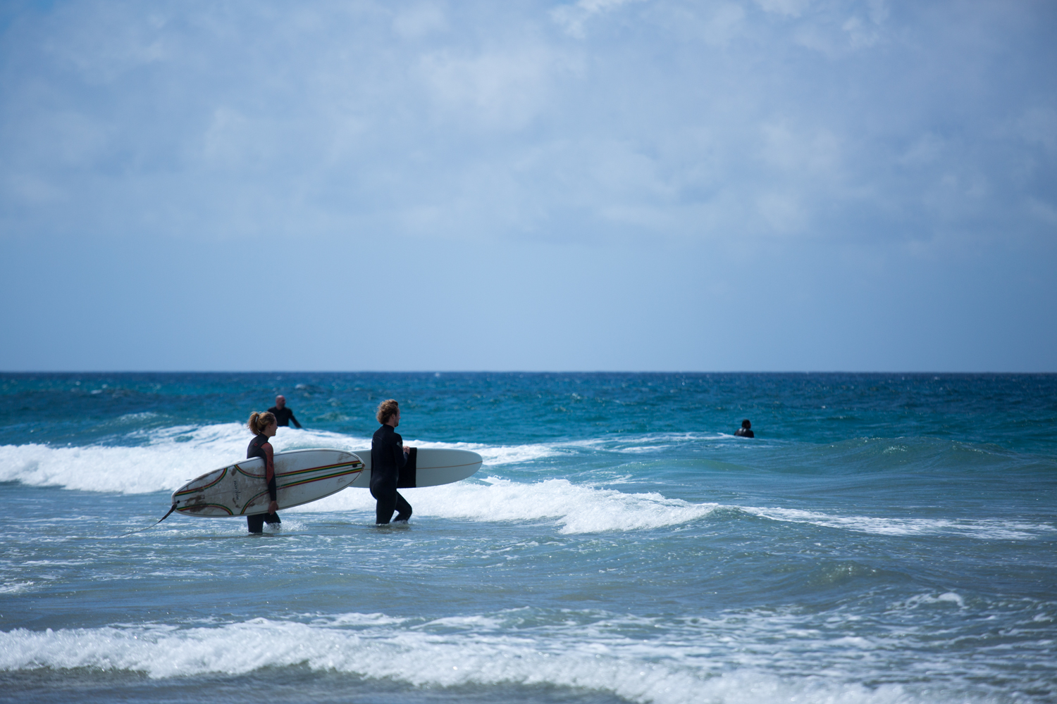 Surfers entering the water El Cotillo, Fuerteventura