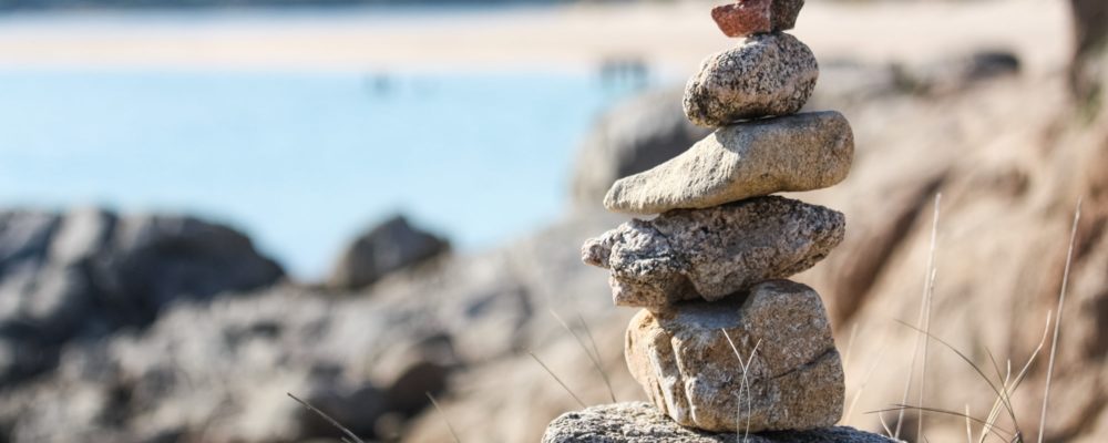 rock stacking on the nora beach