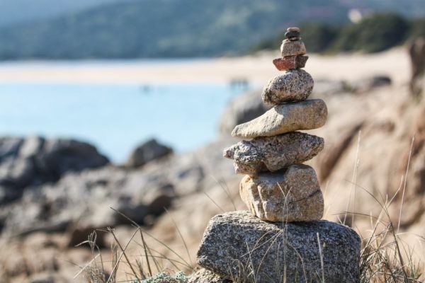 rock stacking on the nora beach