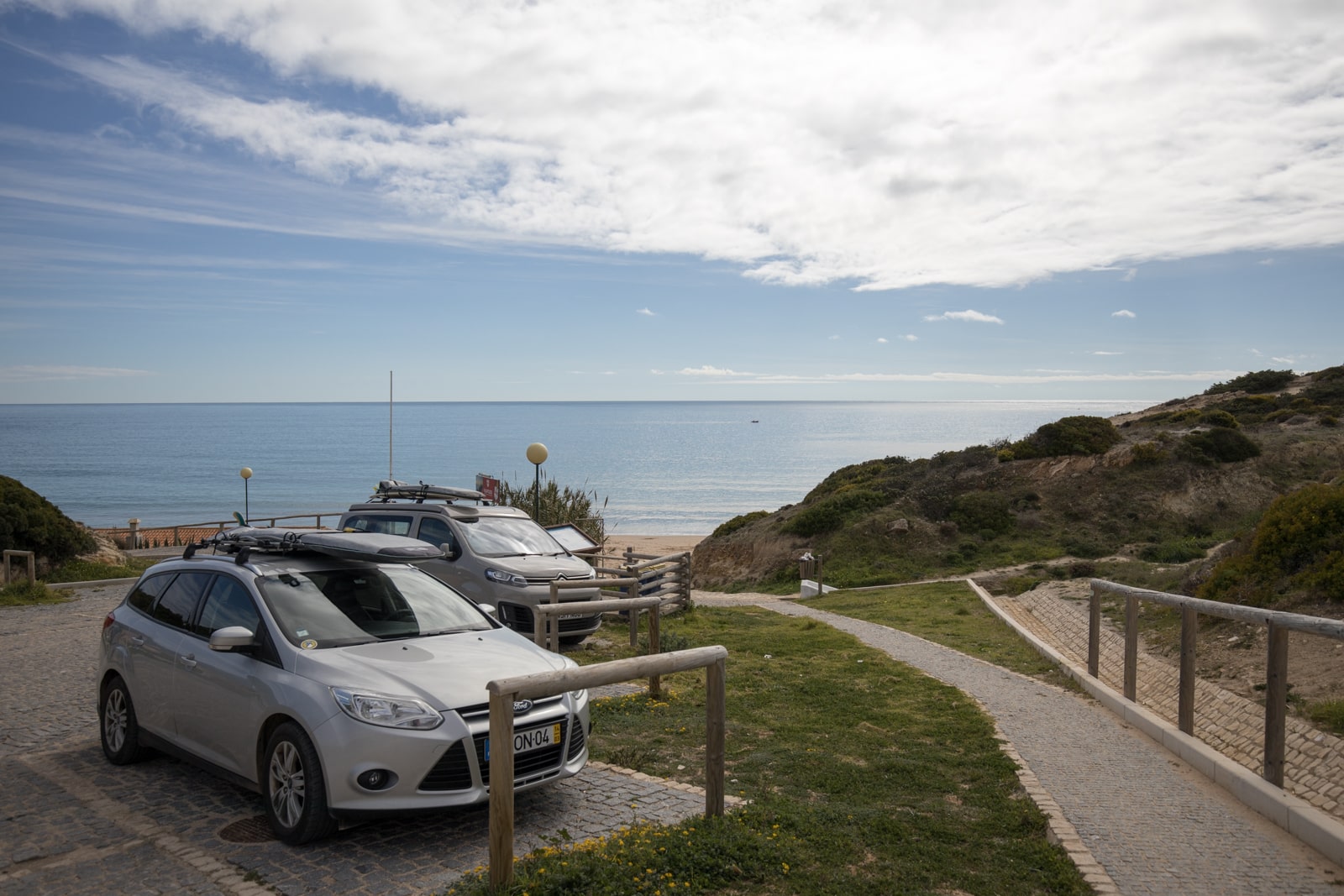 Cars with surfboards in Sagres